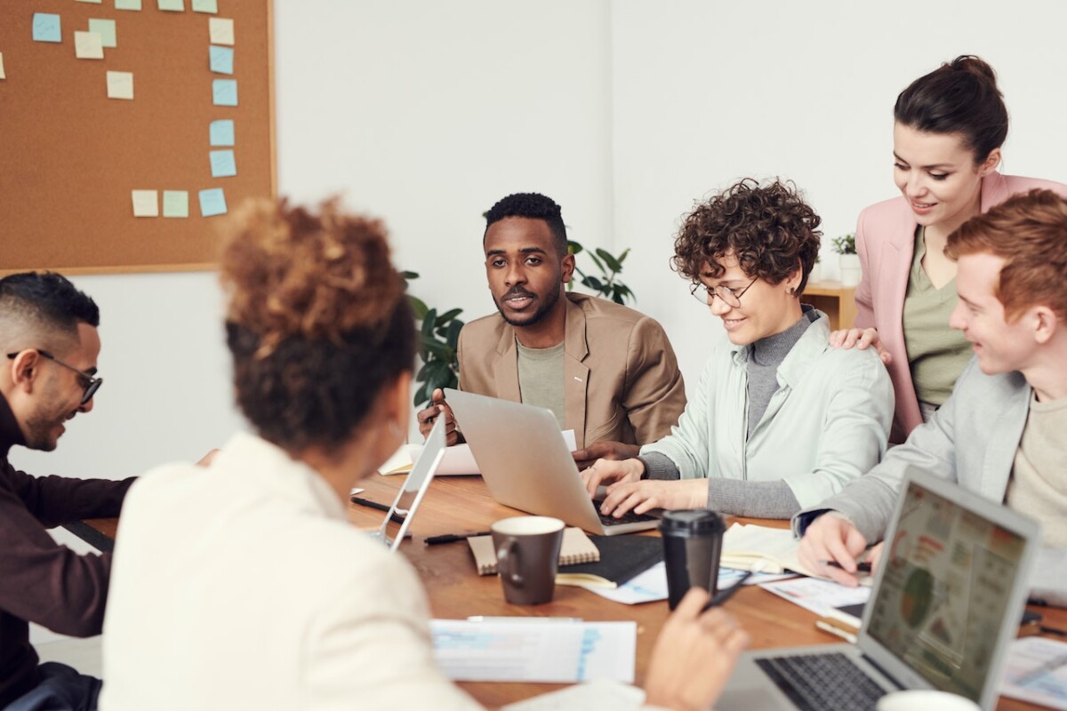 A diverse group of employees around the table